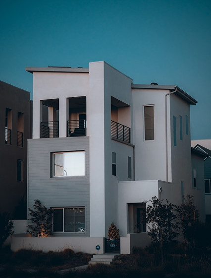 Modern three-storey townhouse at dusk