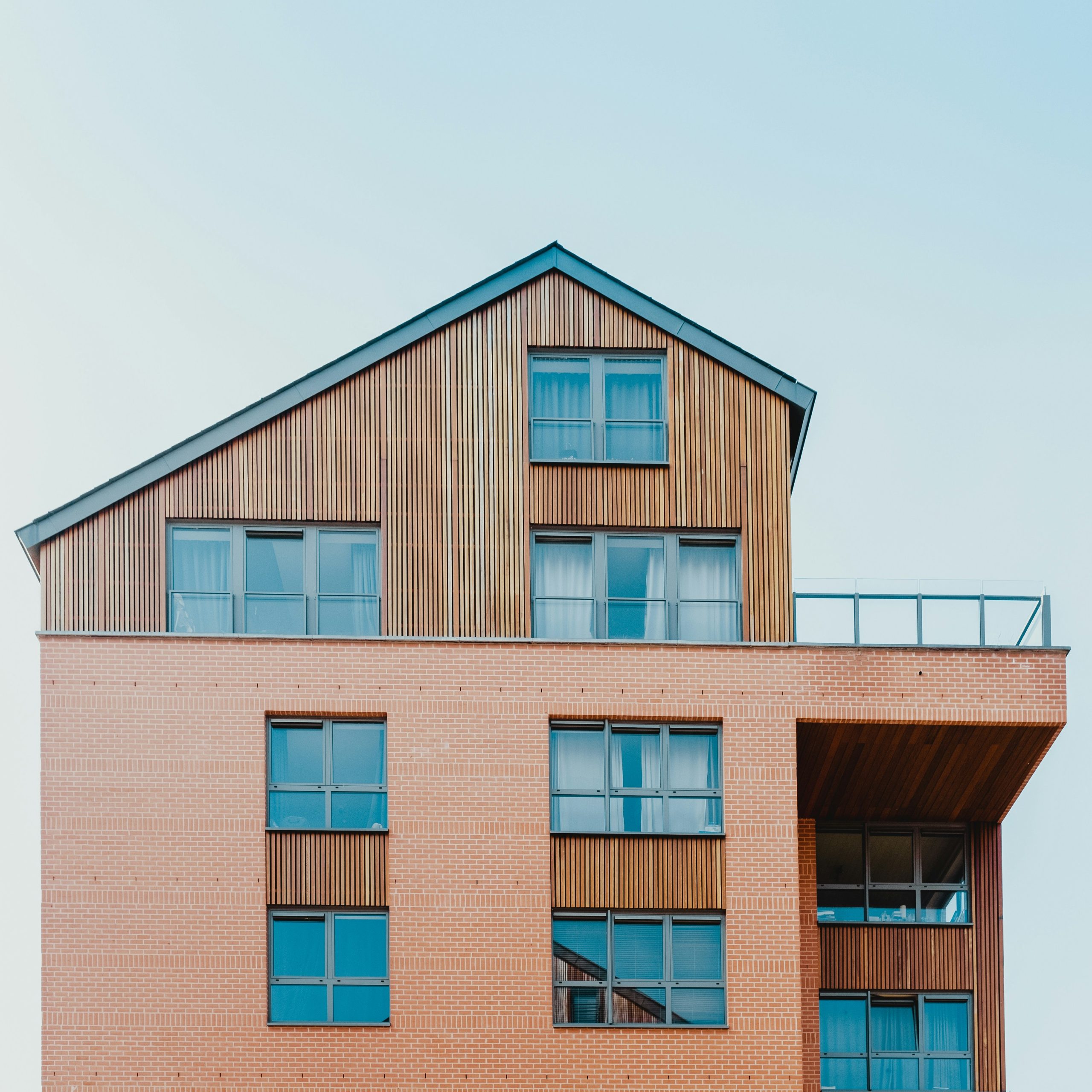 Modern brick apartment building with timber cladding